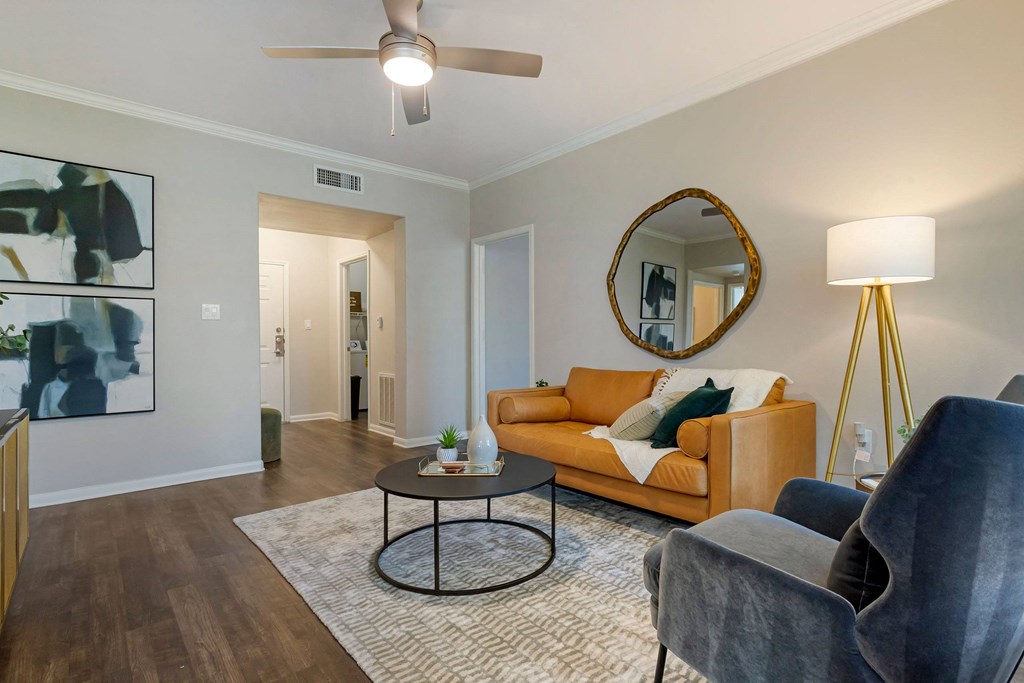 a living room with a couch and a coffee table at Madison on the Meadow, Stafford, Texas