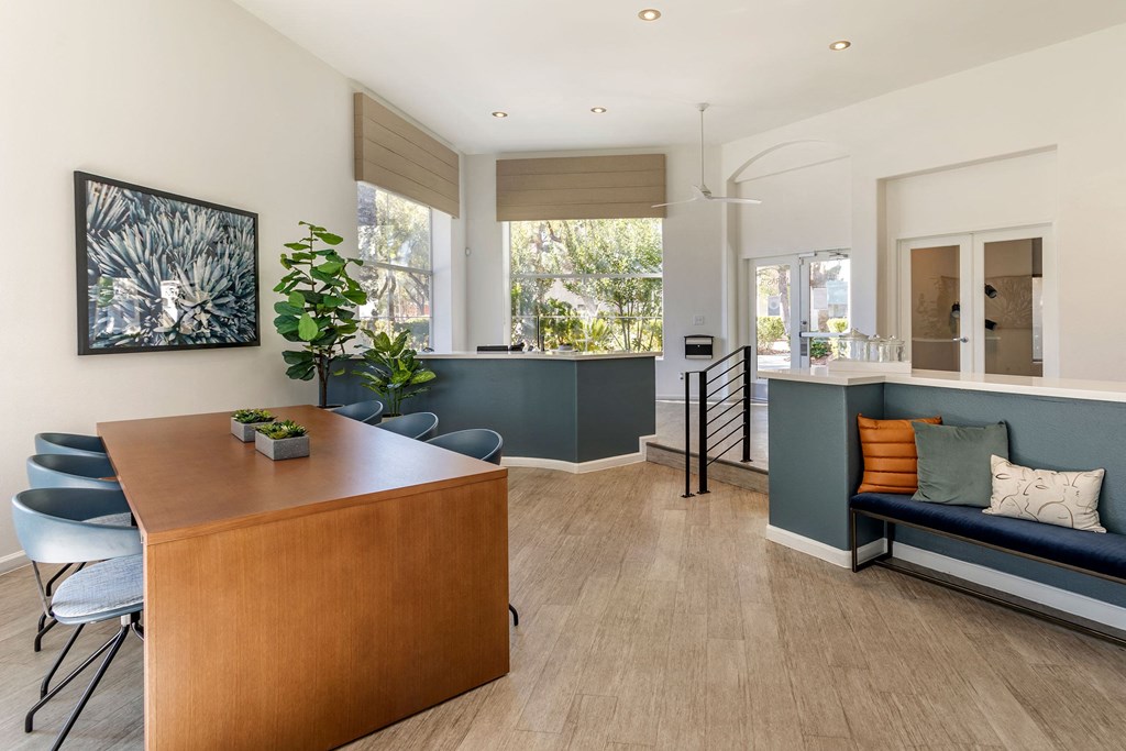a dining room and living room with a table and a couch at Mirasol Apartments, Las Vegas, NV