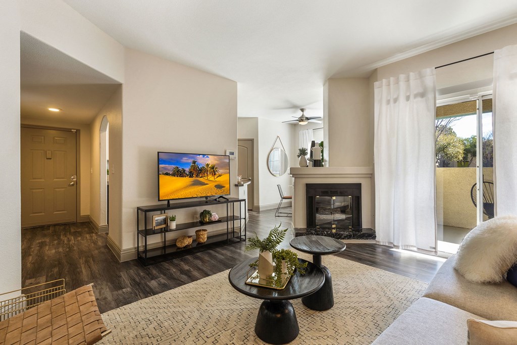 living room with fireplace and tv at Mirasol Apartments, Las Vegas, 89119