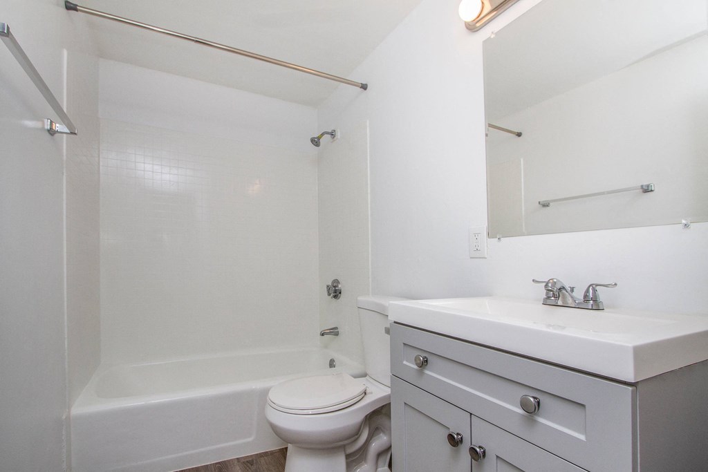 a bathroom with a sink toilet and a bath tub at Palms of Kilani Apartments, Wahiawa, Hawaii