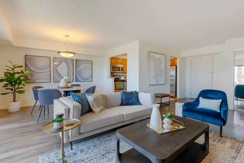 a living room with a couch and a table at The Rays at Vegas Towers Apartments, Las Vegas, 89119