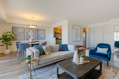 a living room with a couch and a table at The Rays at Vegas Towers Apartments, Las Vegas, 89119