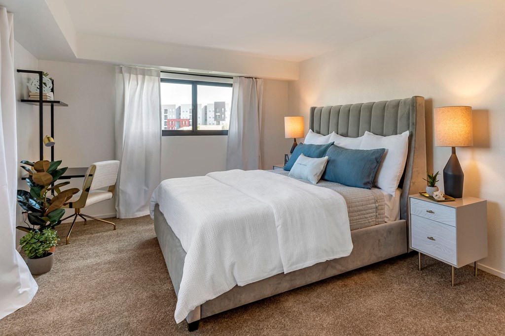a bedroom with a large bed and a window at The Rays at Vegas Towers Apartments, Nevada, 89119