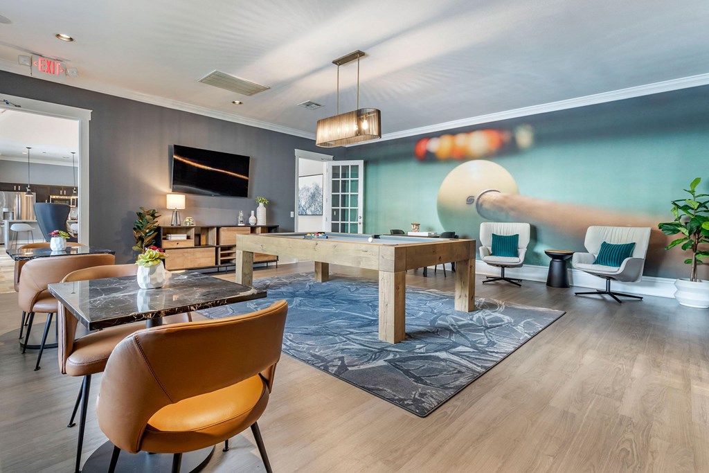 a living room with a dining room table and chairs at Reserve by the Lake, Texas