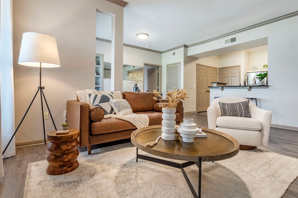 a living room with couches and a coffee table at Reserve by the Lake, Houston