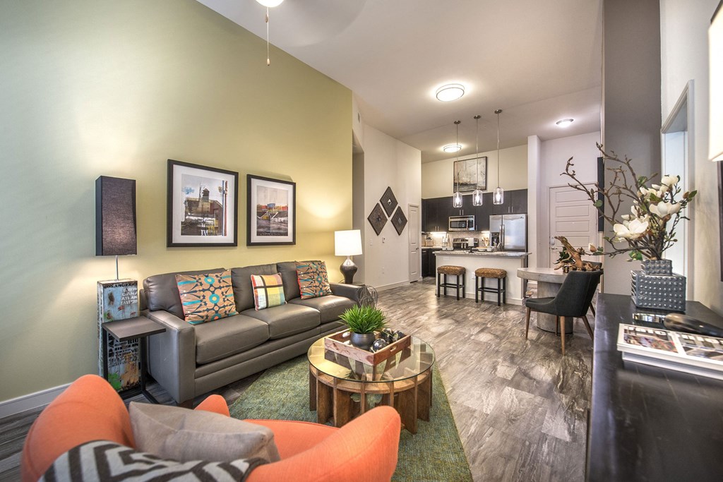 a living room with a couch and a table at South Side Flats, Dallas, TX, 75215