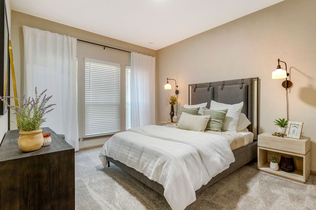 a bedroom with a bed and a window at Summerwind, Texas