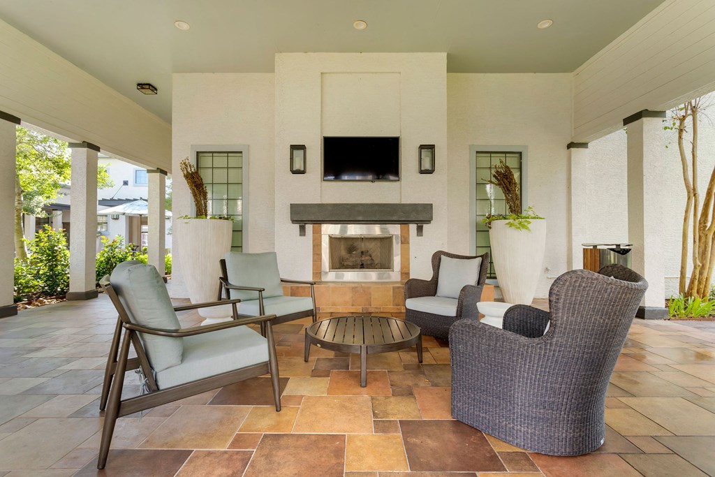 a living room with furniture and a fireplace at Summerwind, Pearland, 77584