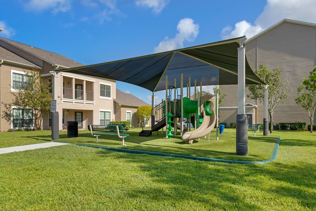 our apartments have a playground with a variety of play equipment at Summerwind, Pearland