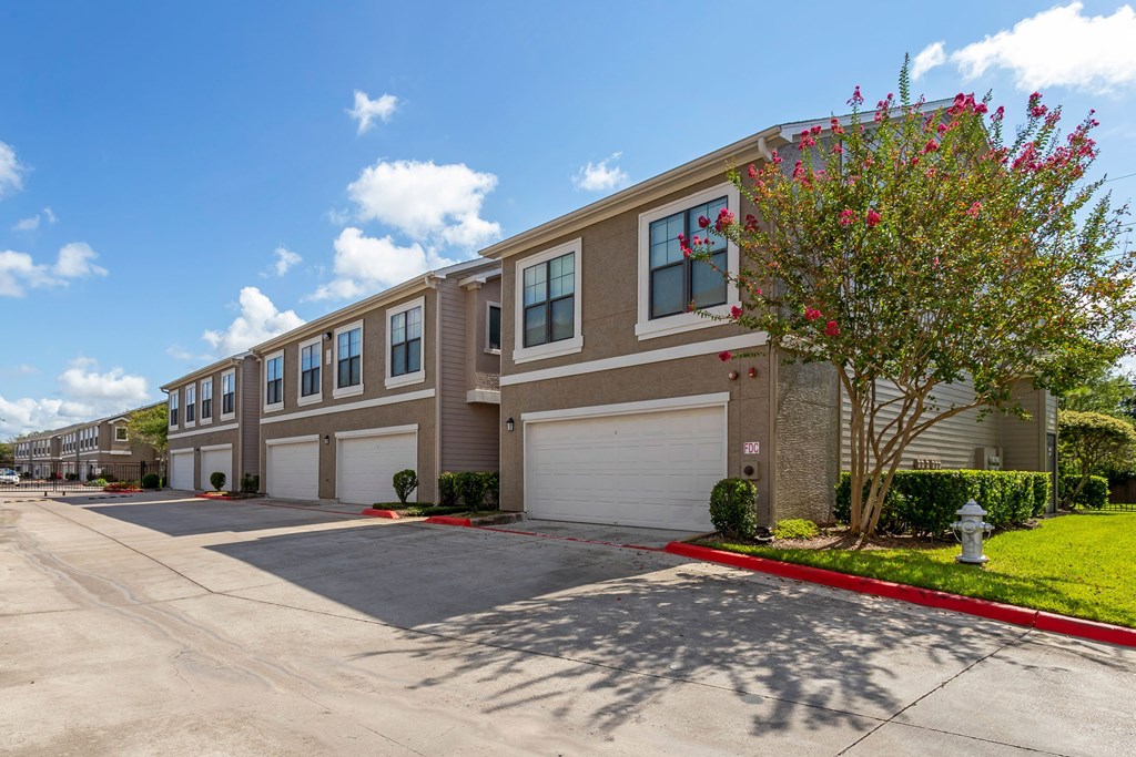 a building with two garages and a street in front of it at Summerwind, Texas