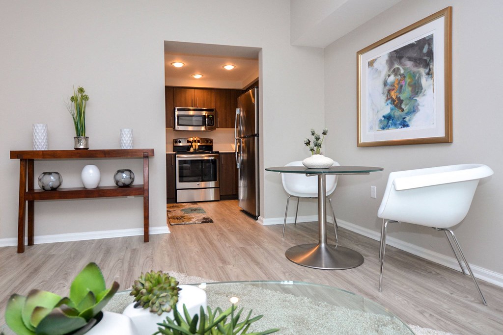 a living room with a dining room and a kitchen at Apartments at Denver Place, Colorado