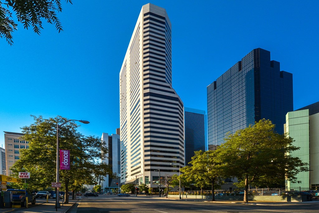 a tall skyscraper in a city with other tall buildings  at Apartments at Denver Place, Colorado, 80202