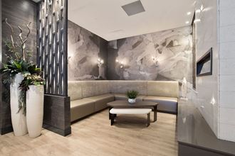a lobby with couches and a coffee table
