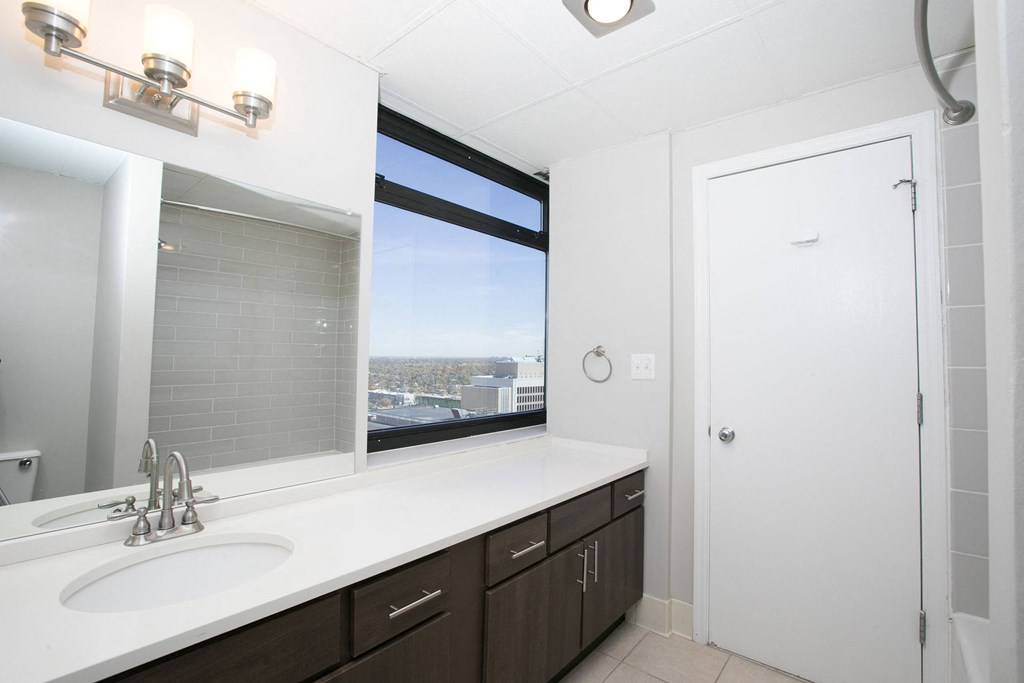 a bathroom with a sink and a window  at Apartments at Denver Place, Colorado