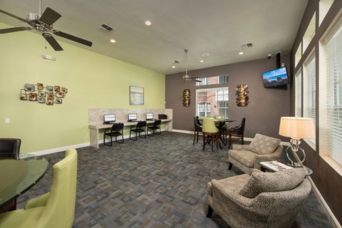 a living room with couches and a table with chairs and a tv at Veranda at Centerfield, Texas, 77070