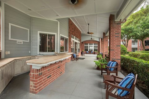 commons front porch with seating and a brick wall at Veranda at Centerfield, Texas