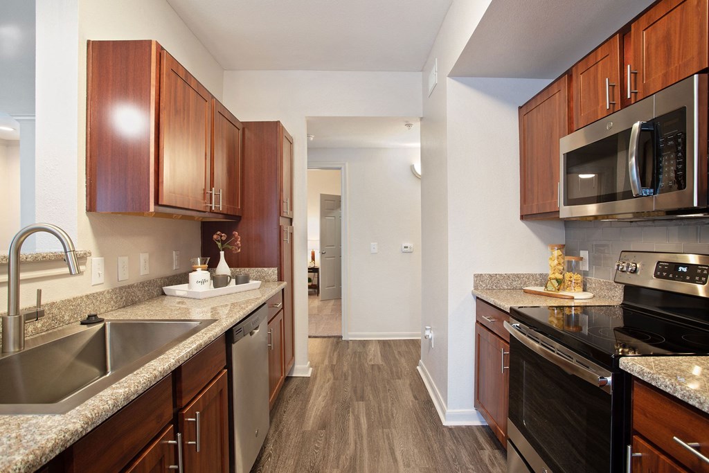 redesigned kitchen with granite counter tops and stainless steel appliances at the reserve at south coast
