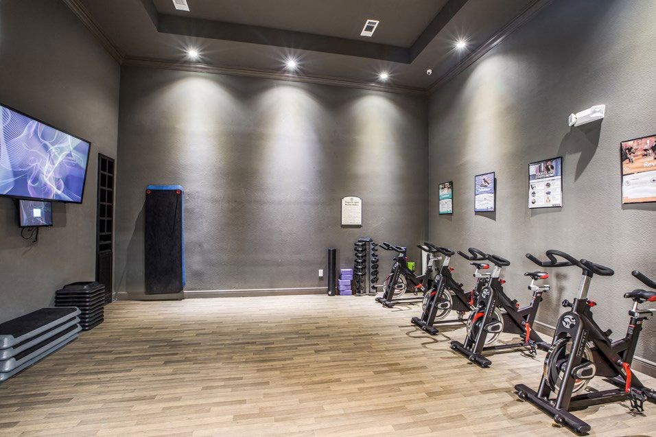 a room filled with bikes and a tv