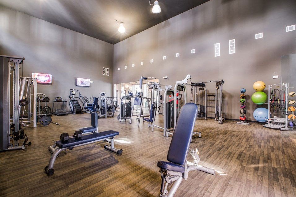 the gym at the flats at big tex apartments