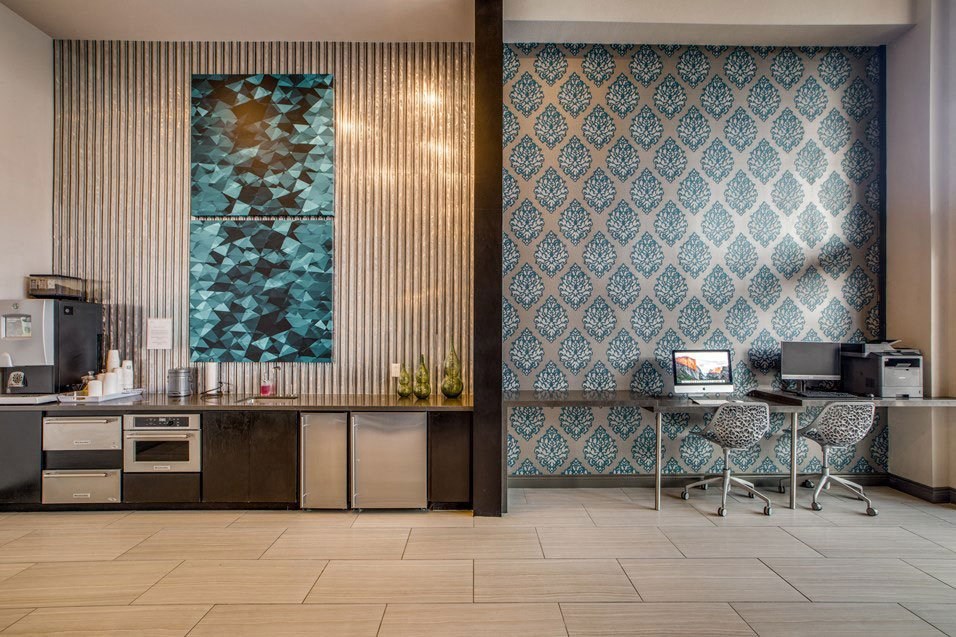 the lobby of a hospital with a desk and a computer