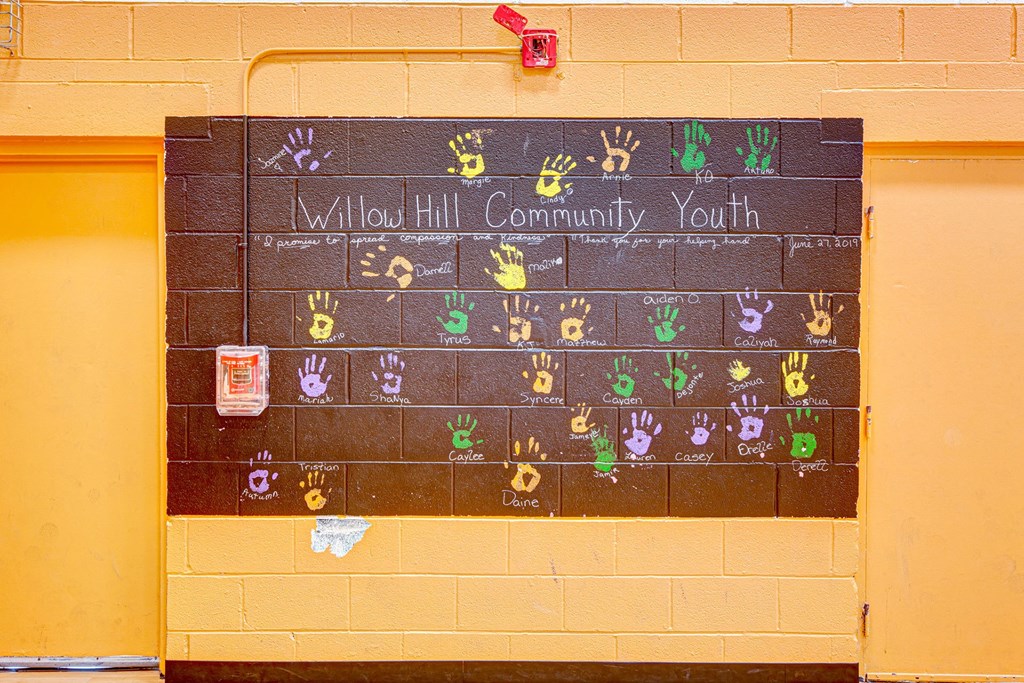 a chalkboard calendar on the wall of a school with the words allied community at Willow Hill Apartments, Justice, 60458