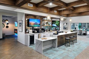 a large kitchen with a large island and a television at Willowest in Collier Hills, Atlanta, 30318