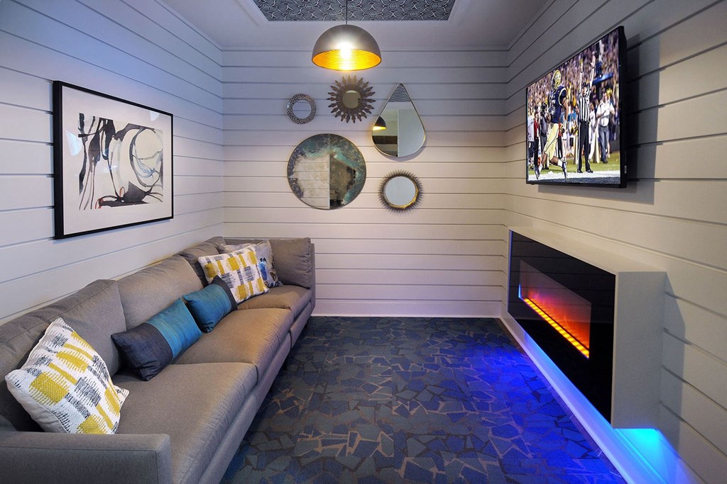 a living room with a couch and a fireplace at Willowest in Collier Hills, Atlanta, GA