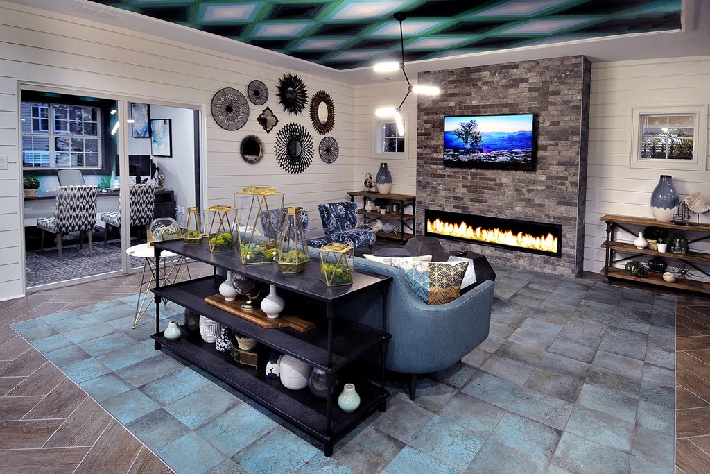 a living room with a fireplace and a television at Willowest in Collier Hills, Atlanta, 30318