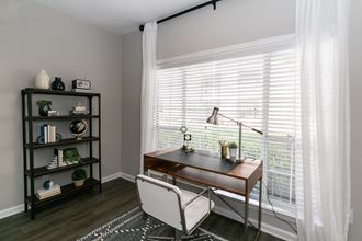 a home office with a large window with white blinds and a desk and chair at Willowest in Collier Hills, Atlanta, Georgia