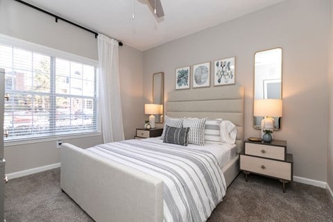 a bedroom with a bed and a large window at Willowest in Collier Hills, Georgia, 30318