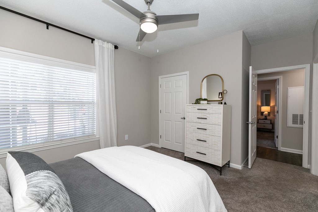 a bedroom with a bed and a ceiling fan a bedroom with a bed and a ceiling fan at Willowest in Collier Hills, Georgia