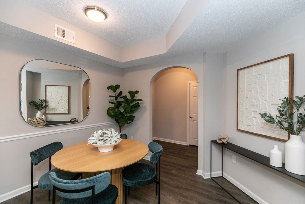 a dining room with a table and four chairs a dining room with a table and four chairs at Willowest in Lindbergh, Atlanta
