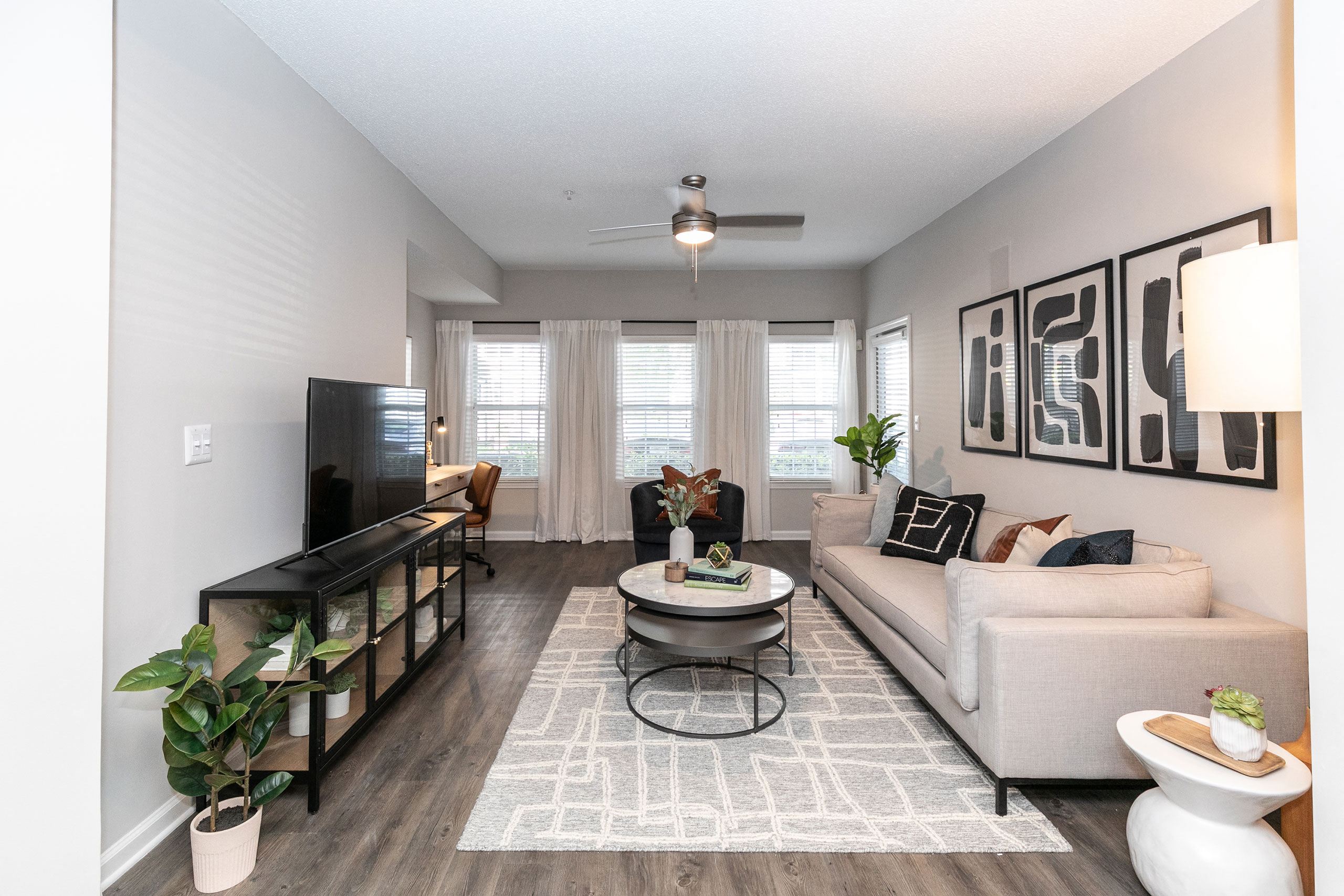 an open living room with a couch and a table at Willowest in Lindbergh, Georgia, 30318