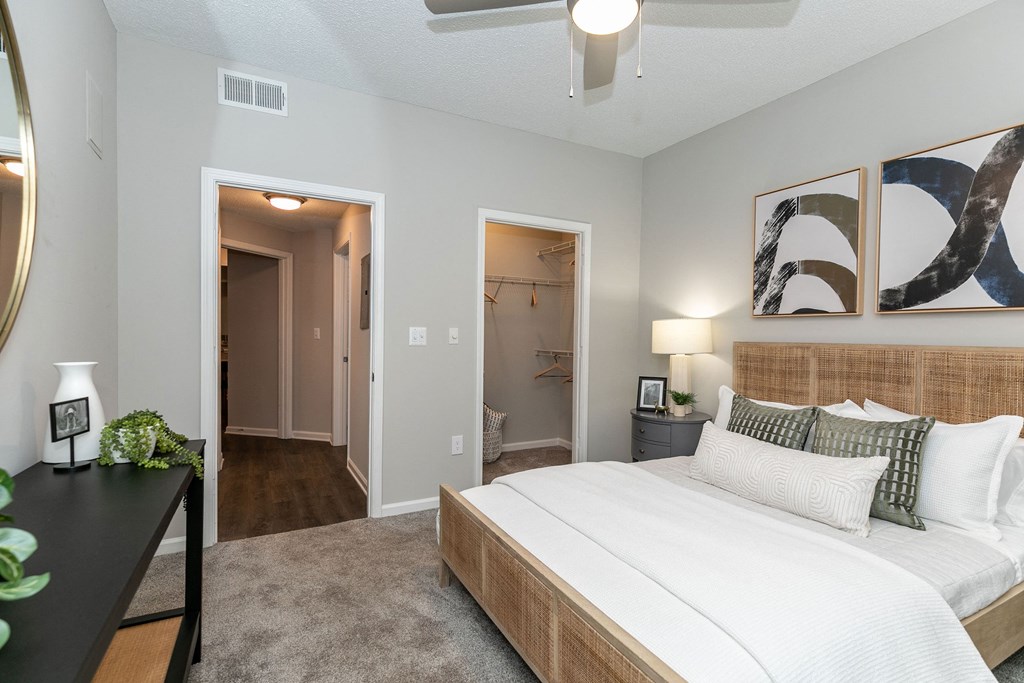 a bedroom with a large bed and a closet a bedroom with a large bed and a closet at Willowest in Lindbergh, Atlanta, GA