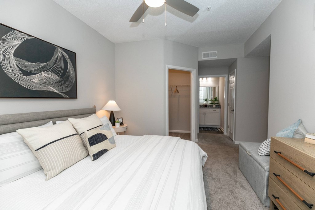 a bedroom with a large white bed and a ceiling fan a bedroom with a large white bed and a ceiling fan at Willowest in Lindbergh, Atlanta, Georgia