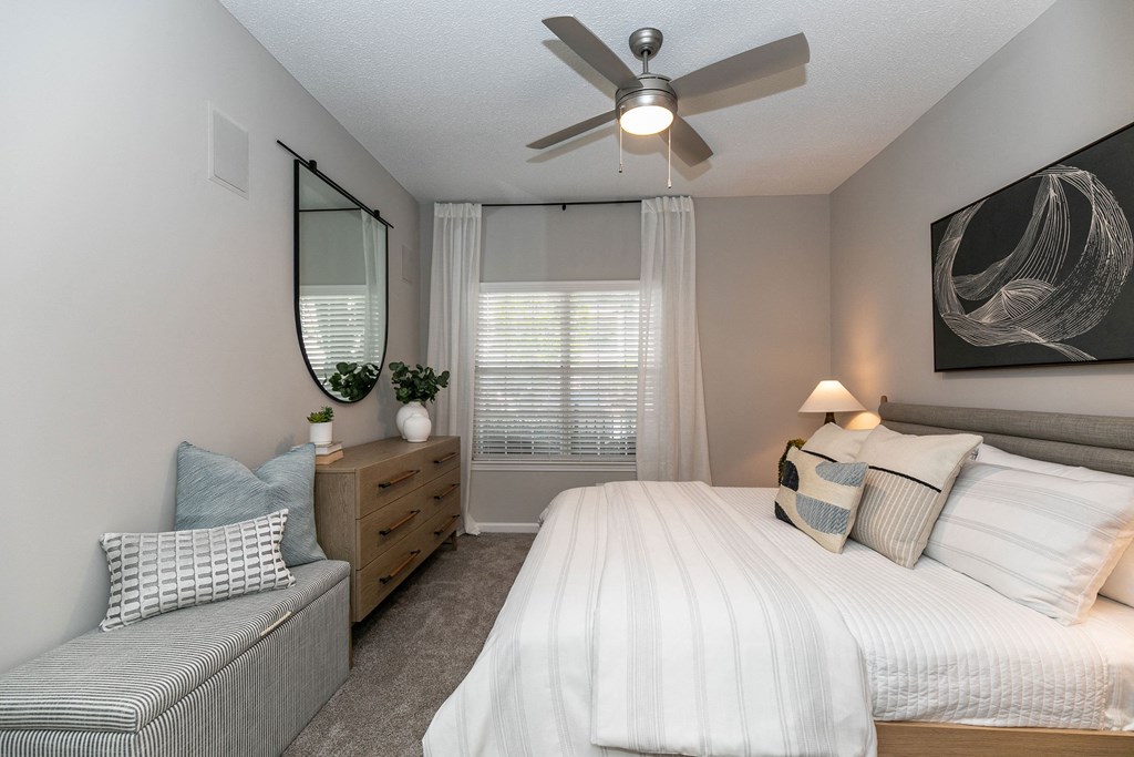 create a relaxing bedroom with a large bed and a ceiling fan create a relaxing bedroom with a large bed and a ceiling fan at Willowest in Lindbergh, Atlanta