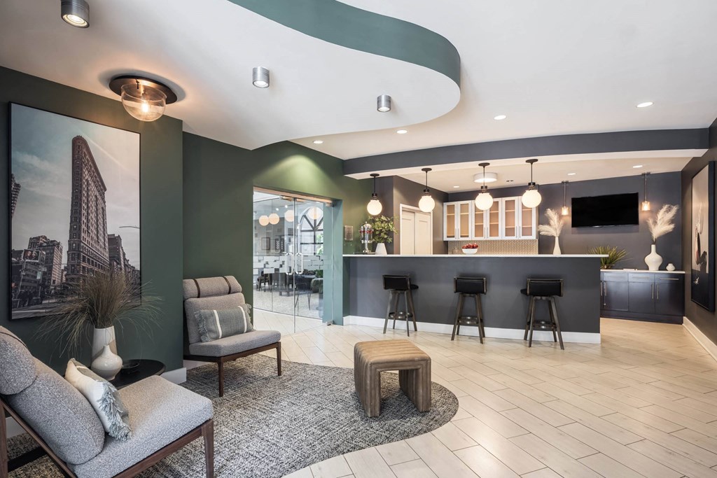 a lobby with tables and chairs and a bar at 15 Bank Apartments, White Plains, NY