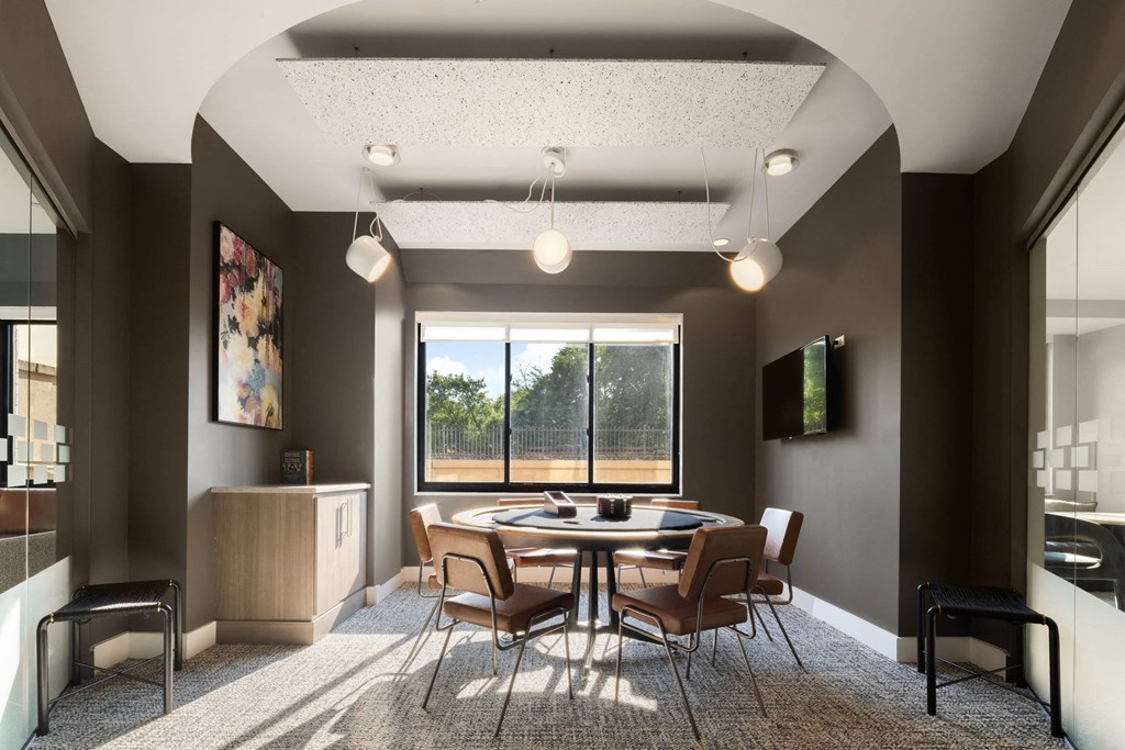 a conference room with a table and chairs and a window at 15 Bank Apartments, White Plains