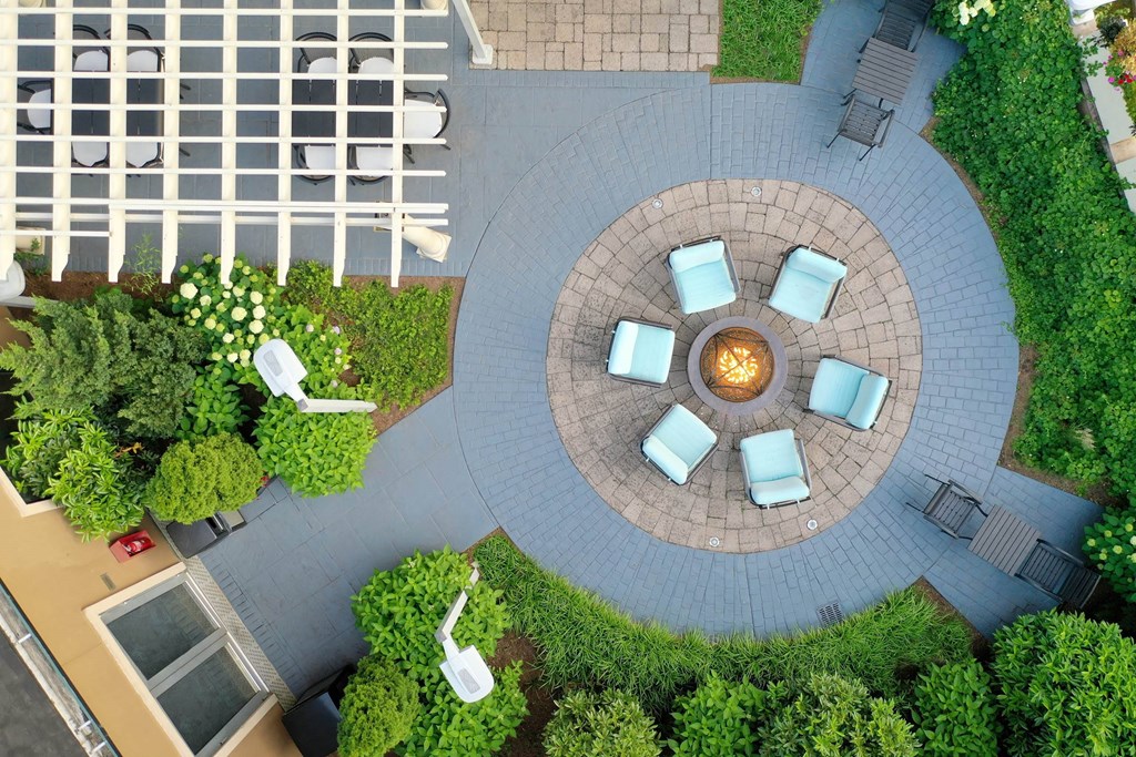 a courtyard with chairs and a fire pit at 15 Bank Apartments, White Plains, NY, New York