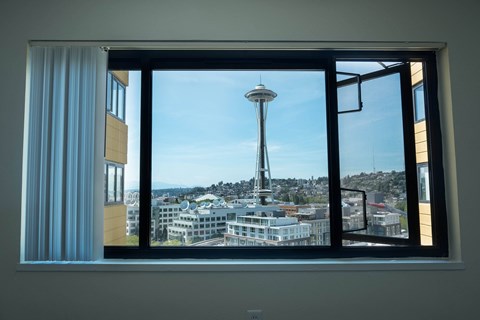 A view of the Space Needle from a window at Skye at Belltown Apartments, Seattle, WA