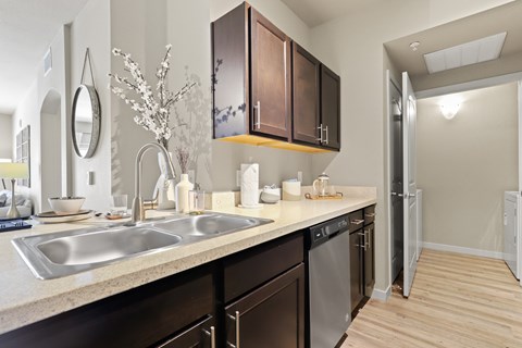 our spacious kitchen is equipped with stainless steel appliances and a large sink at Ridge at Thornton Station Apartments, Thornton, Colorado