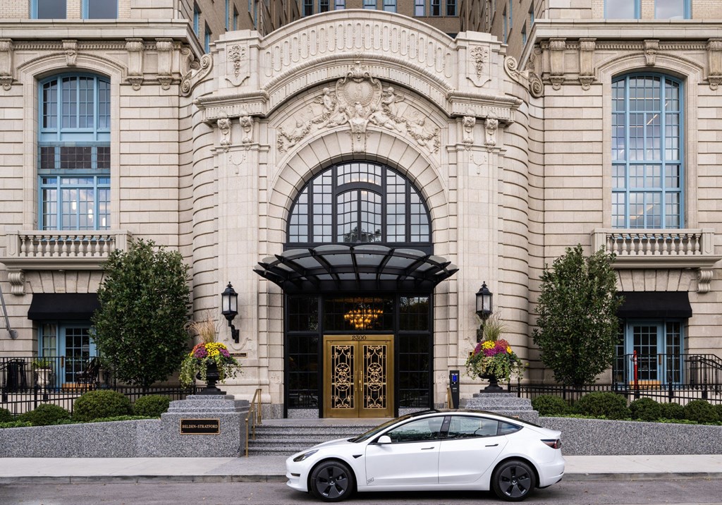 a white car parked in front of a building  at The Belden Stratford, Chicago, Illinois