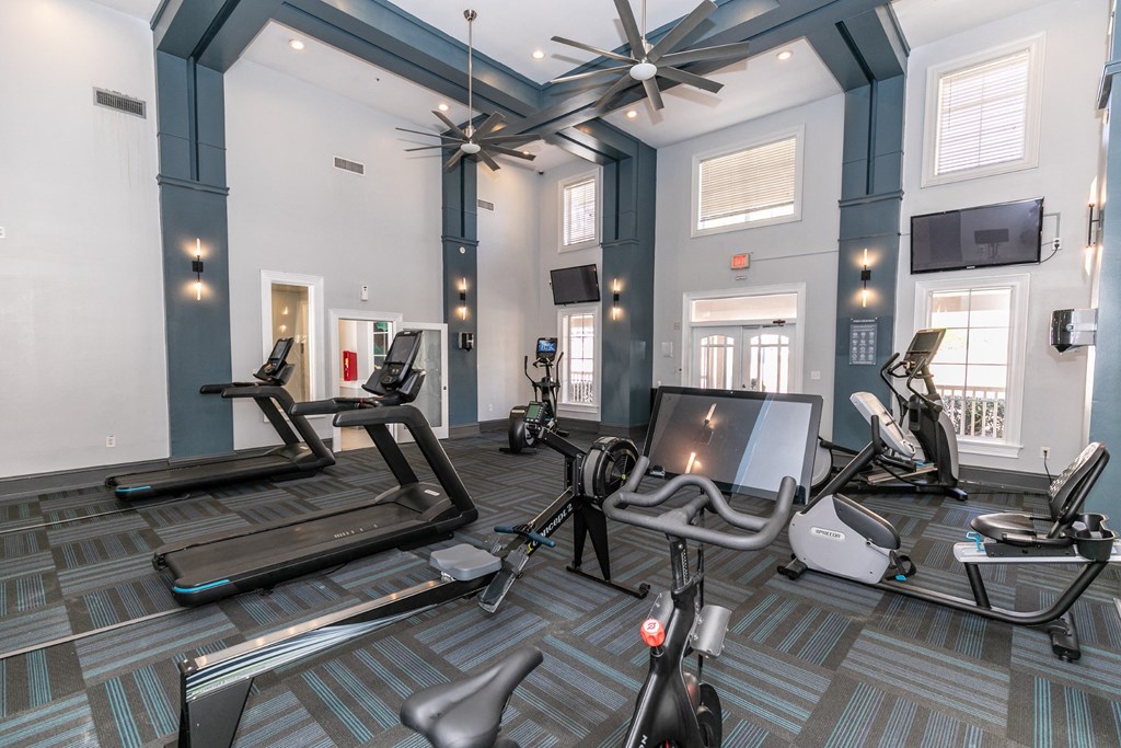 a gym with treadmills and other exercise equipment at Roswell Village, Georgia, 30075