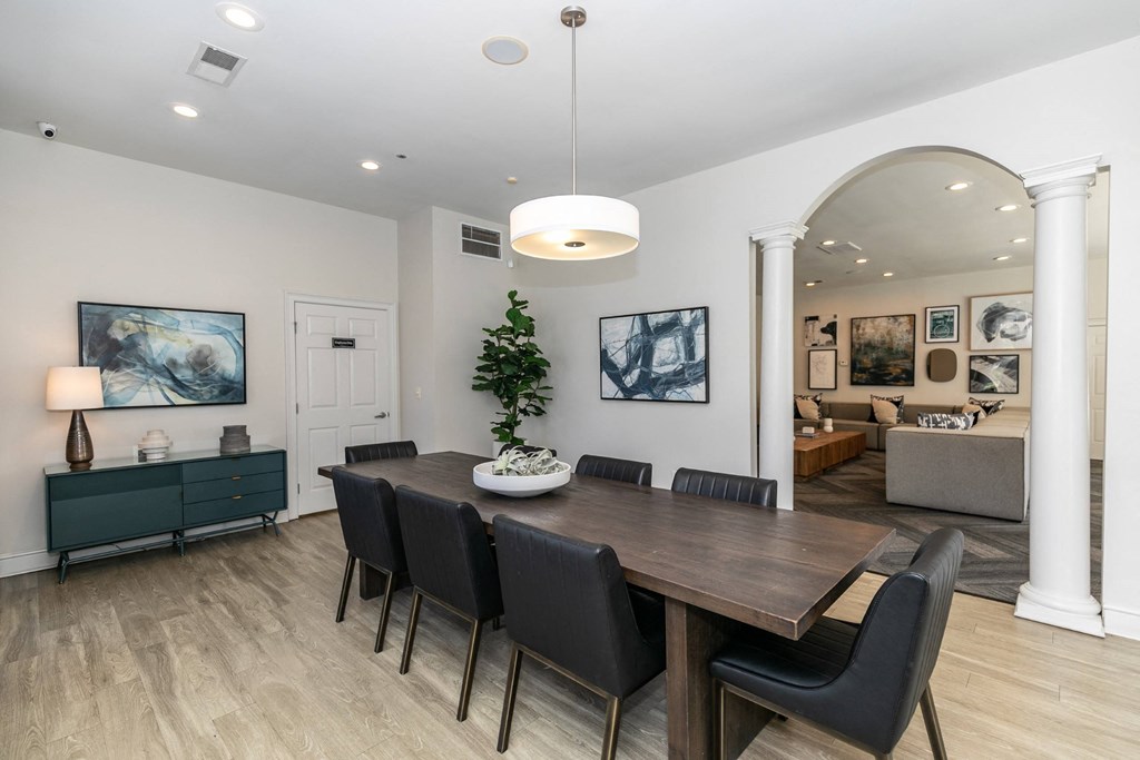 a dining room with a wooden table and black chairs at Roswell Village, Georgia, 30075
