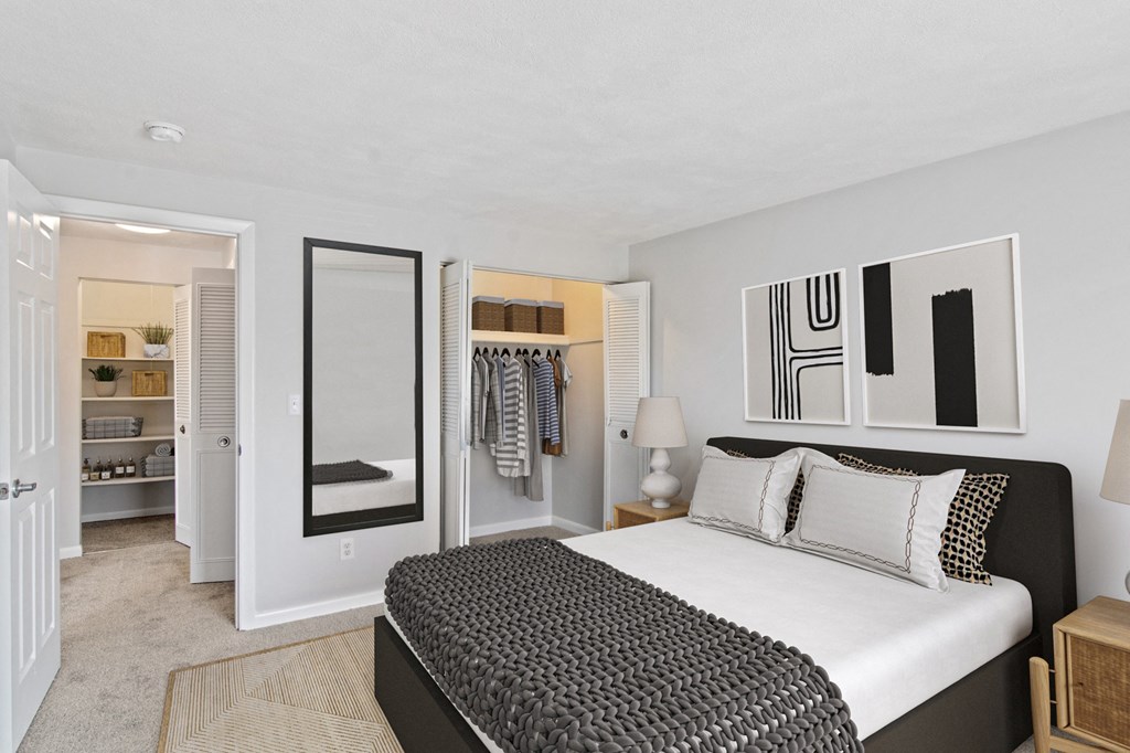a bedroom with a bed and a closet at Rosemont Square, Randolph, 02368