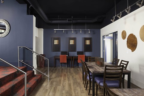 A dining room with a wooden table and chairs at Skye at Belltown Apartments, Seattle, WA 98121