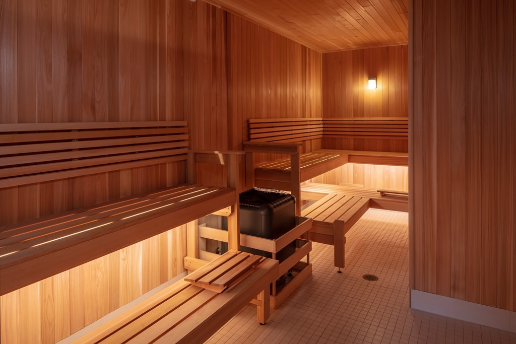 Wooden sauna room with benches and a table at 365 Nicollet, Minneapolis, 55401