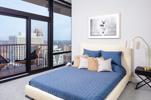 Spacious Bedrooms with a large bed and a view of the city at 365 Nicollet, Manchester