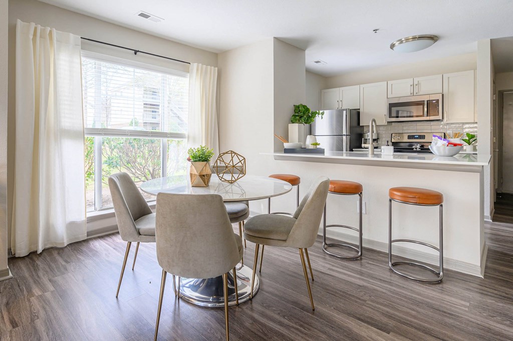 a kitchen and dining room with a table and chairs at Ashford Green, Charlotte, NC