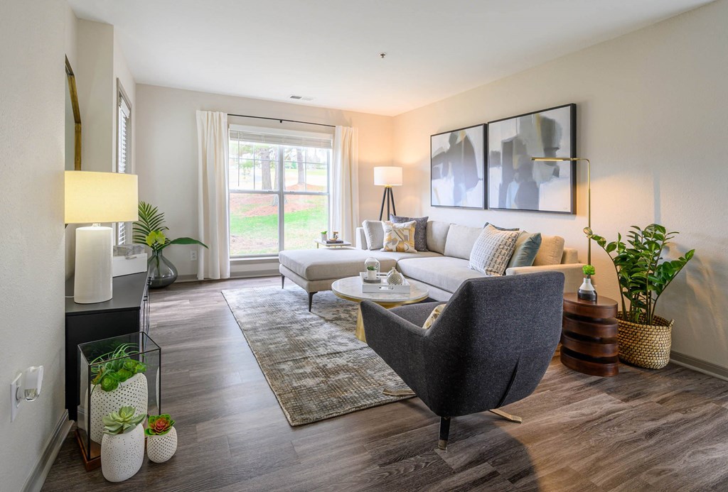 a living room with a couch and a chair at Ashford Green, Charlotte
